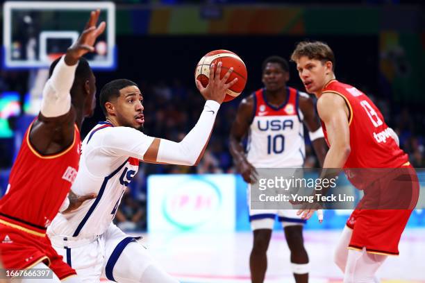 Tyrese Haliburton of the United States looks for a pass against Dennis Schroder of Germany in the first quarter during the FIBA Basketball World Cup...
