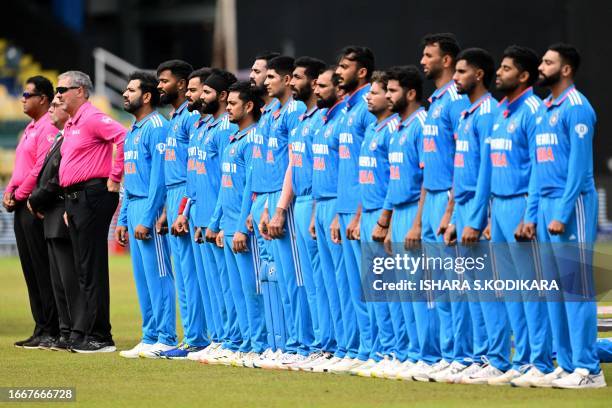 India's players stand for the national anthem before the start of the Asia Cup 2023 Super Four one-day international cricket match between India and...