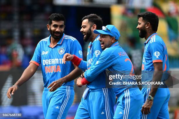 India's Virat Kohli and his teammates gesture before the start of the Asia Cup 2023 Super Four one-day international cricket match between India and...