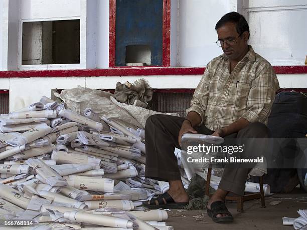 Employee sorting letters in front of the main post office in the capital of Himachal Pradesh..