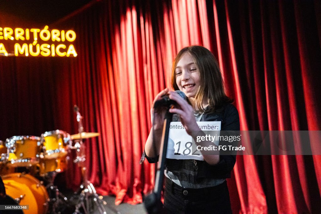 Girl singing in a music contest
