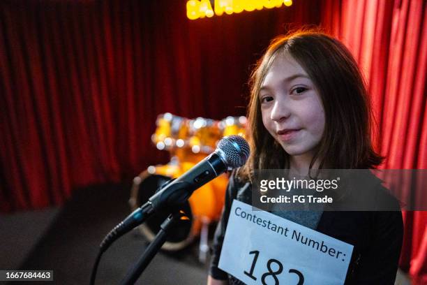 portrait of a girl singing in a music contest - looking at camera celebrity stock pictures, royalty-free photos & images