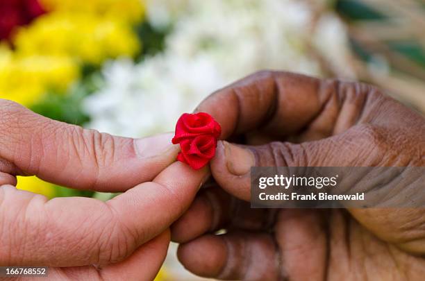 Little artificial flower given to a tourist for gift as a sign for being welcome.