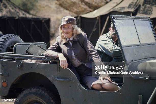 Loretta Swit sitting in a jeep during the filming of television show M*A*S*H, United States, August 1976. She plays the character Maj. Margaret "Hot...