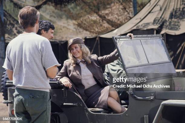 Mike Farrell, Alan Alda and Loretta Swit during the filming of television show M*A*S*H, United States, August 1976. They play the characters Capt....