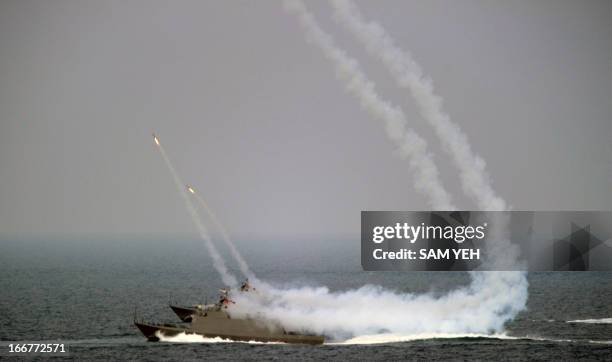 Two Taiwan-made Kuang Hua 6 missile boats launch HF-II anti-ship missiles in a military drill in western Penghu islands on April 17, 2013. Taiwan's...