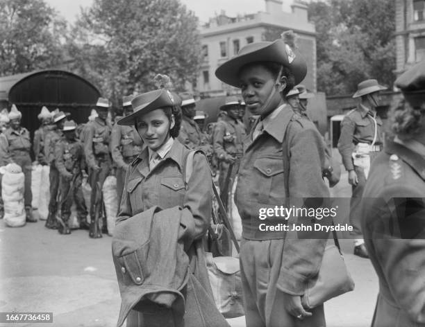 Two women soldiers from Mauritius arriving in London to take part in the victory celebrations, May 25th 1946. They are to form part of the East...