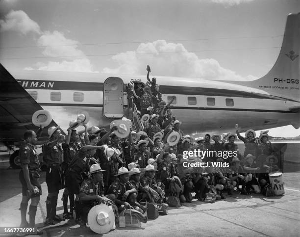 Boy Scouts from Jamaica posing for a group photo on arrival at London Airport, July 13th 1957. The 60 Scouts had been aboard the liner 'Reina del...