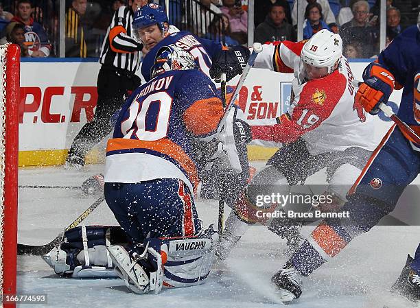 Evgeni Nabokov of the New York Islanders makes the third period save on Scottie Upshall of the Florida Panthers at the Nassau Veterans Memorial...