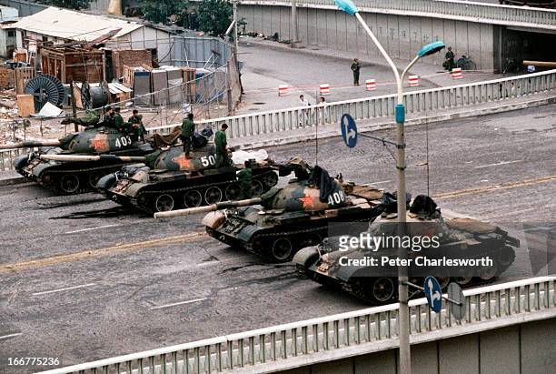 At the end of the pro-democracy movement in China a group of Chinese Army tanks block an overpass on Changan Avenue leading to Tiananmen Square where...