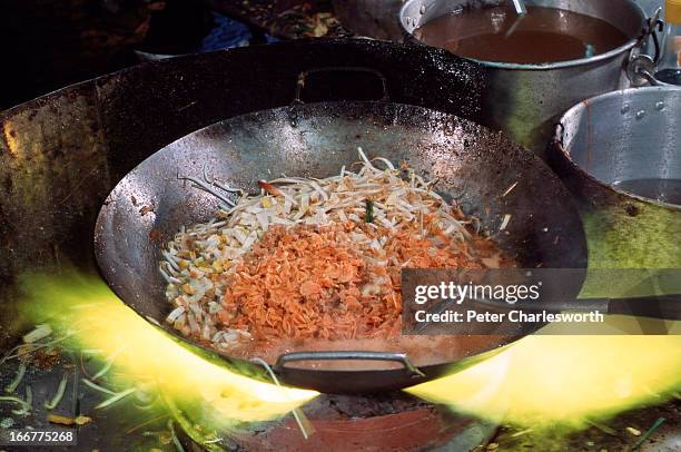 Cooking Thailand's most famous noodle dish, phad thai at Thip Samai, a small eatery in Rattanakosin district. Phad thai consists of thin noodles...