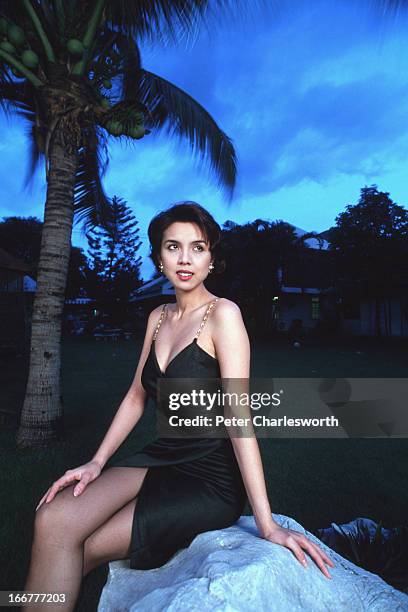 Thai Pop star and MTV presenter Christina Aguilar posing for a portrait in the garden of her Bangkok home..