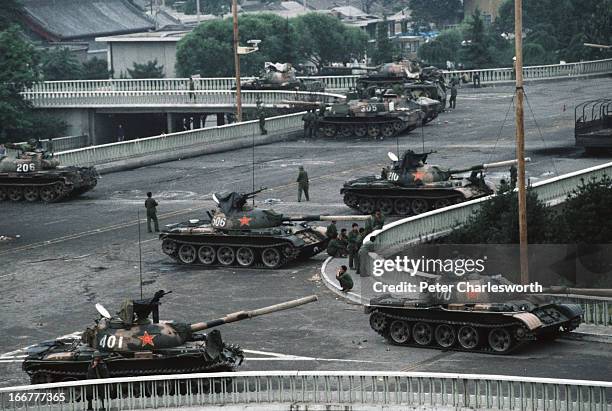 At the end of the pro-democracy movement in China a group of Chinese Army tanks block an overpass on Changan Avenue leading to Tiananmen Square where...