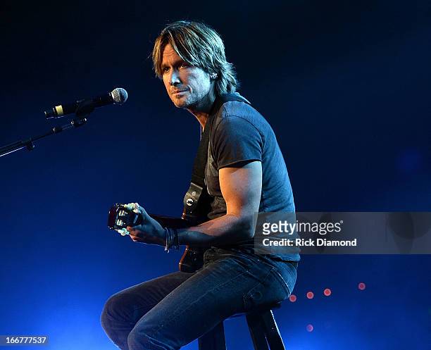 Keith Urban performs during Keith Urban's Fourth annual We're All For The Hall benefit concert at Bridgestone Arena on April 16, 2013 in Nashville,...