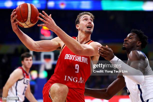 Franz Wagner of Germany drives to the basket against Jaren Jackson Jr. #13 of the United States in the fourth quarter during the FIBA Basketball...