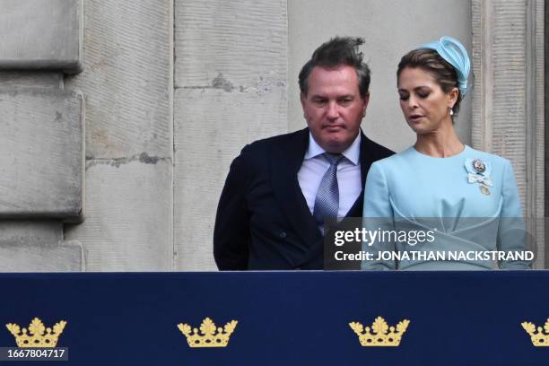 Sweden's Princess Madeleine and her husband British-American financier Christopher O'Neill are pictured on the balcony as the King oversees the...