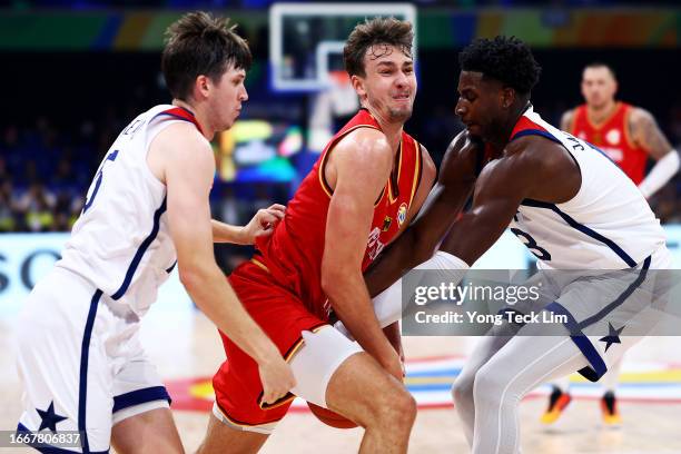 Franz Wagner of Germany drives against Austin Reaves and Jaren Jackson Jr. #13 of the United States in the fourth quarter during the FIBA Basketball...