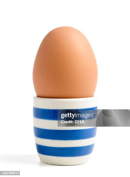 free range egg in vintage porcelain cup - egg cup stock pictures, royalty-free photos & images