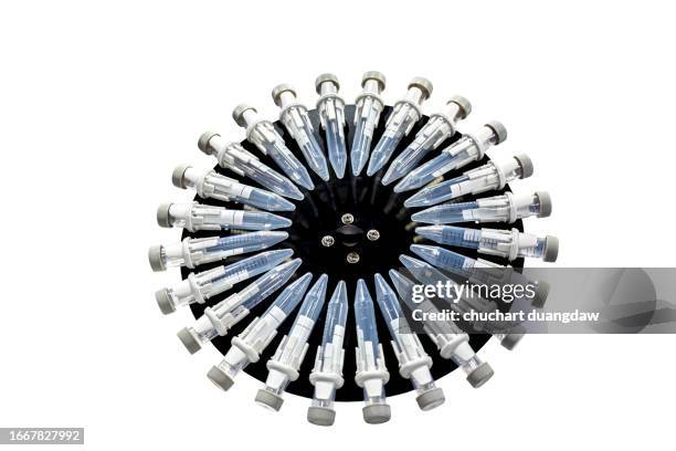 test tubes with blood tube rotator - hiv prevention stock pictures, royalty-free photos & images
