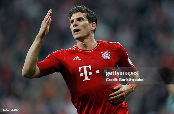 Mario Gomez of Muenchen celebrates his team's fifth goal during the DFB Cup Semi Final match between Bayern Muenchen and VfL Wolfsburg at Allianz...