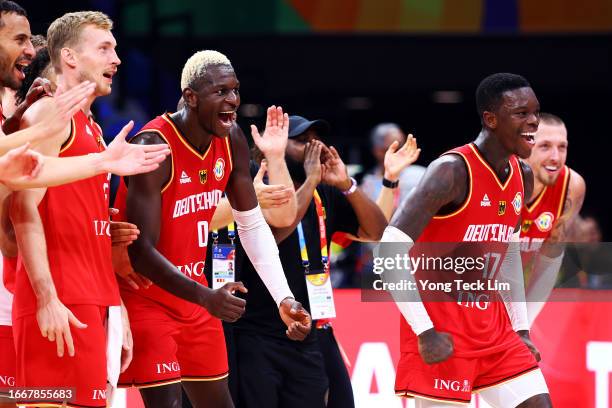 Dennis Schroder of Germany celebrates with teammates after the FIBA Basketball World Cup semifinal game victory over the United States at Mall of...