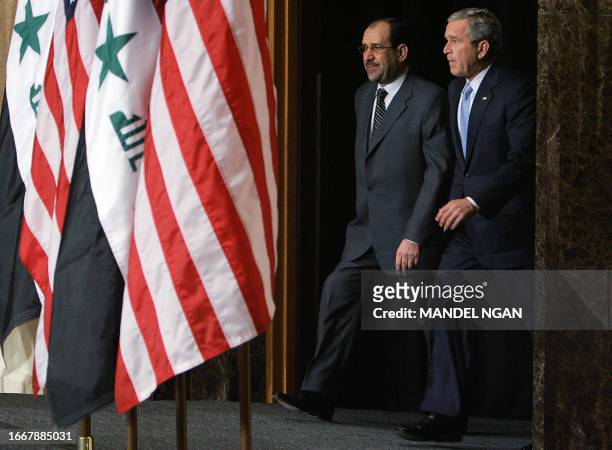 President George W. Bush and Iraqi Prime Minister Nouri Maliki arrive at a joint press conference at the Four Seasons Hotel in Amman, Jordan, 30...