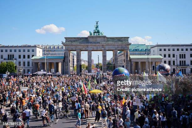 Dpatop - 15 September 2023, Berlin: "Save the climate" is written on a balloon as thousands of people take part in the Fridays for Future climate...