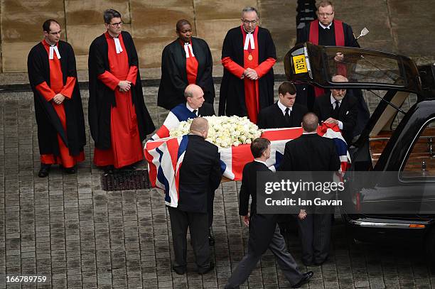 The coffin is transferred to the hearse during the Ceremonial funeral of former British Prime Minister Baroness Thatcher on April 17, 2013 in London,...