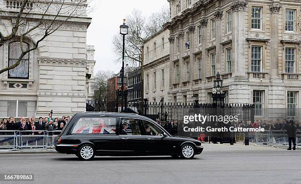 The hearse makes its way past Downing Street during the Ceremonial funeral of former British Prime Minister Baroness Thatcher on April 17, 2013 in...