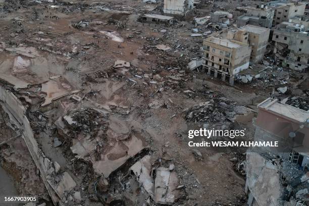 In this aerial view, the rubble of buildings destroyed in flash floods are scattered on the muddy ground, after the Mediterranean storm "Daniel" hit...