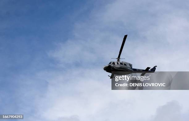 Croatian police helicopter patrols near the village of Bogomolje along the border with Bosnia and Herzegovina on September 15 to prevent the entry of...