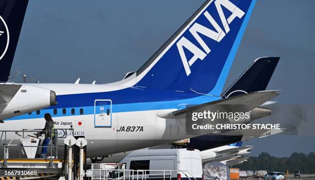 All Nippon Airways machine stays parked at the Lufthansa terminal of the Franz-Josef-Strauss-airport in Munich, southern Germany, on September 15,...