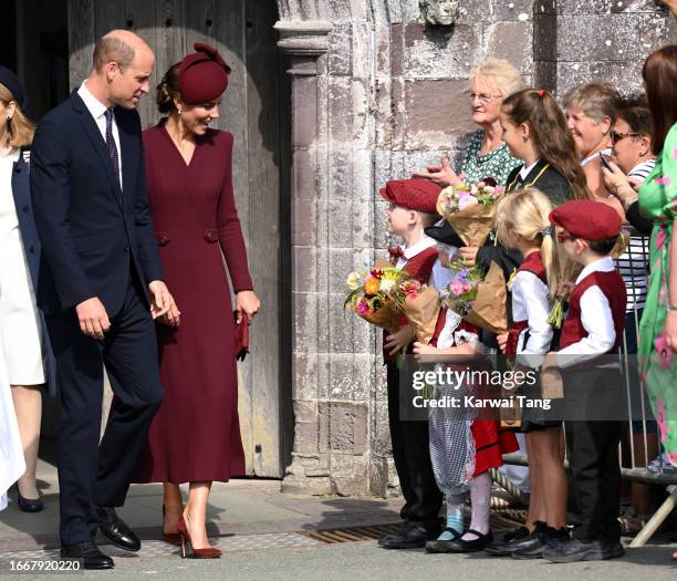 Catherine, Princess of Wales and Prince William, Prince of Wales depart after visiting St Davids Cathedral for a service to commemorate the first...