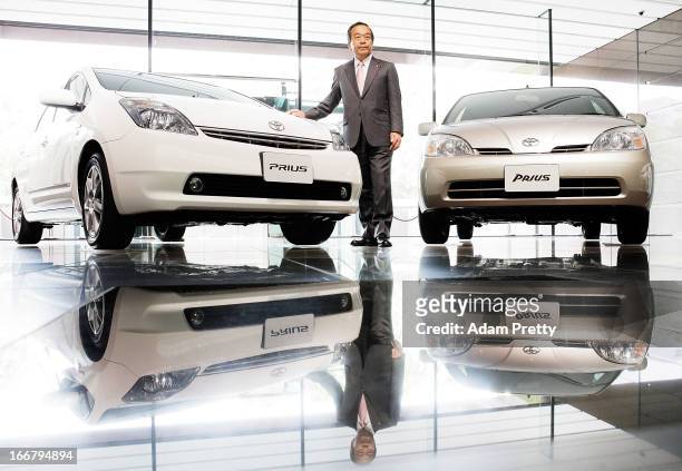 Vice Chairman of Toyota Mr Takeshi Uchiyamada poses with Prius cars after speaking to the media on April 17, 2013 in Tokyo, Japan. Toyota announces...