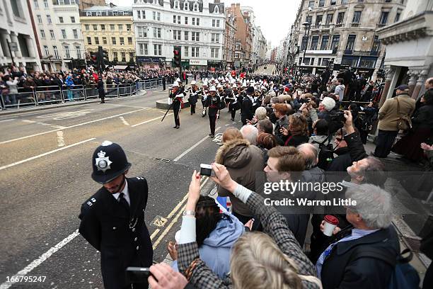 Wellwishers line the route during the Ceremonial funeral of former British Prime Minister Baroness Thatcher on Fleet Street on April 17, 2013 in...