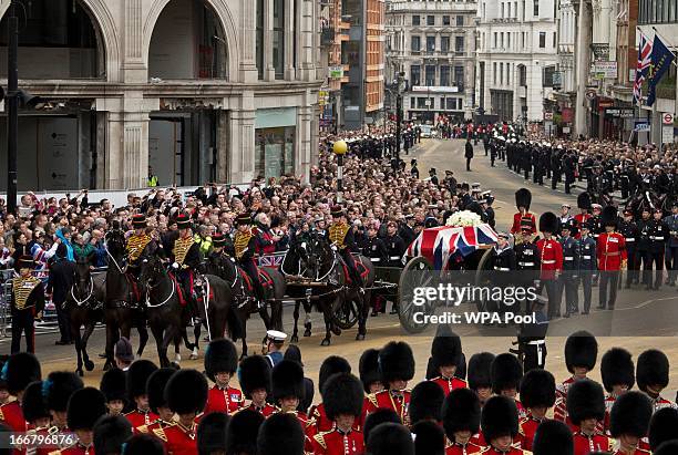 Union flag draped coffin bearing the body of former British Prime Minister Margaret Thatcher is carried on a gun carriage drawn by the King's Troop...