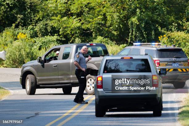 State Police stop vehicles on the perimeter of a search zone for an escaped prisoner on September 08, 2023 in Kennett Square, Pennsylvania. Law...