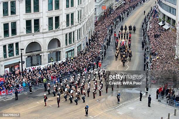 The funeral cortege carrying the coffin of former British Prime Minister Margaret Thatcher passes along Ludgate Hill towards St Paul's Cathedral on...