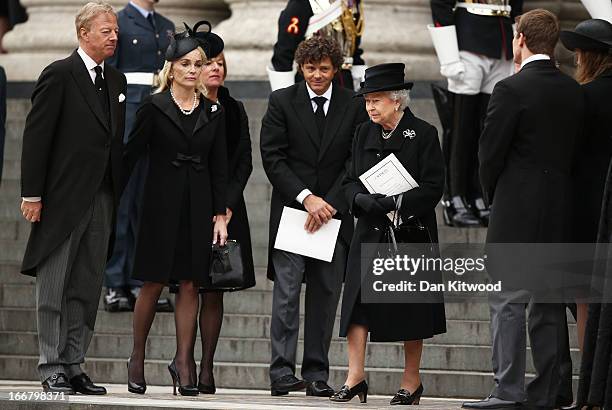 Queen Elizabeth II, Sarah Thatcher, Mark Thatcher, Carol Thatcher, Marco Grass, Michael Thatcher and Amanda Thatcher depart the Ceremonial funeral of...