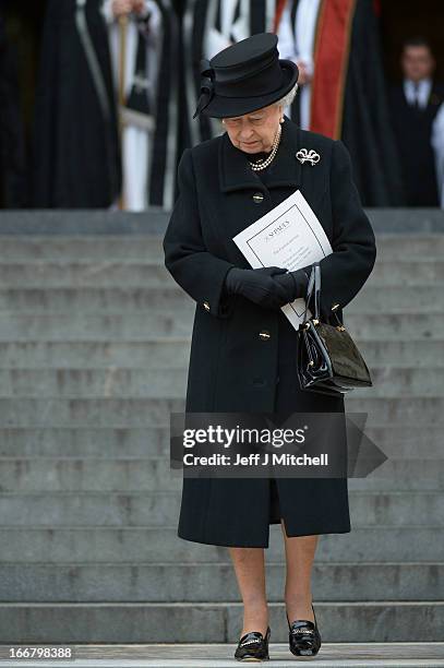 Queen Elizabeth II departs the Ceremonial funeral of former British Prime Minister Baroness Thatcher at St Paul's Cathedral on April 17, 2013 in...