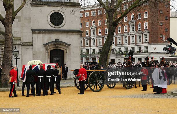 The coffin is transferred to the gun carriage drawn by the Kings Troop Royal Horse Artillery at the Church of St Clement Danes during the Ceremonial...