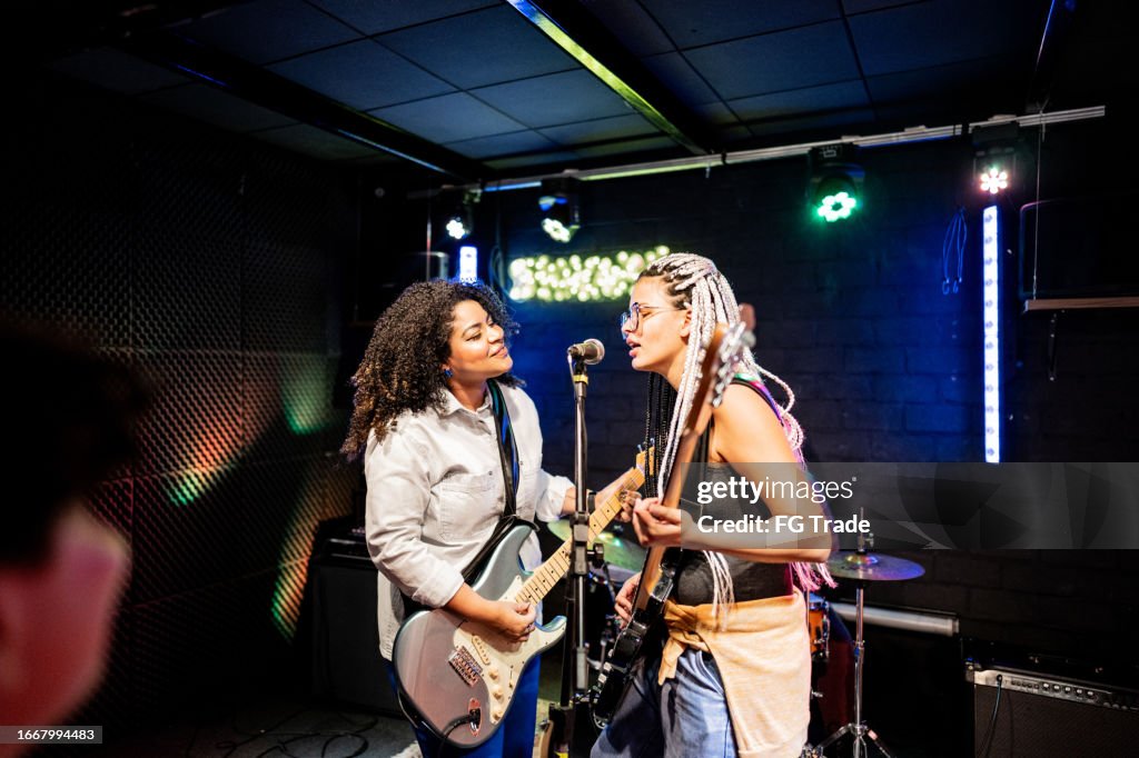 Musicians playing and singing on a show