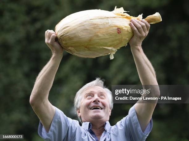 Gareth Griffin with his world record breaking giant onion that weighs 8.97kg , following the giant vegetable competition at the Harrogate Autumn...