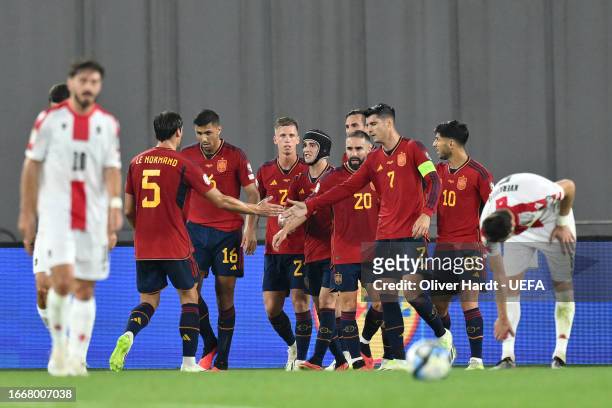 Players of Spain celebrate their side's second goal, an own goal scored by Solomon Kverkvelia of Georgia , during the UEFA EURO 2024 European...