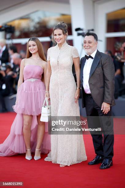 Jennifer Caroletti, Eva Henger and Massimiliano Caroletti attend a red carpet for the movie "Hors-Saison " at the 80th Venice International Film...