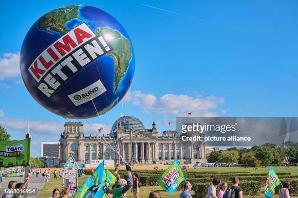 September 2023, Berlin: "Save the climate" is written on a balloon as thousands of children, young people and adults take part in the protest action...
