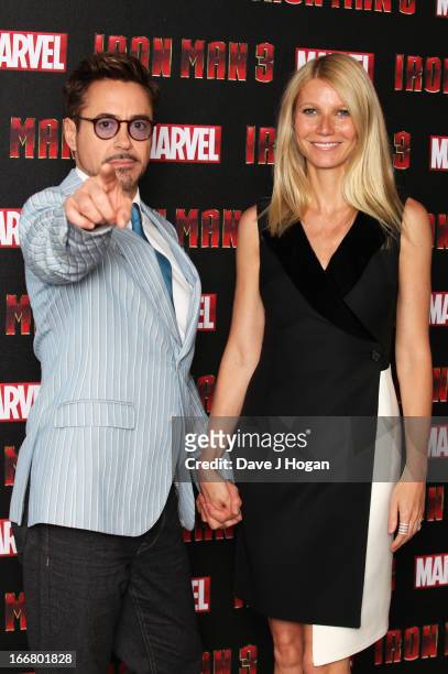 Gwyneth Paltrow and Robert Downey Jr attend a photocall for 'Iron Man 3' at The Dorchester Hotel on April 17, 2013 in London, England.