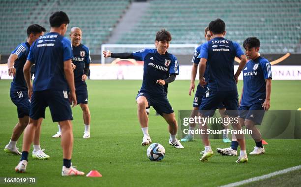 Players of Japan warm up during a training session at Volkswagen Arena on September 08, 2023 in Wolfsburg, Germany.