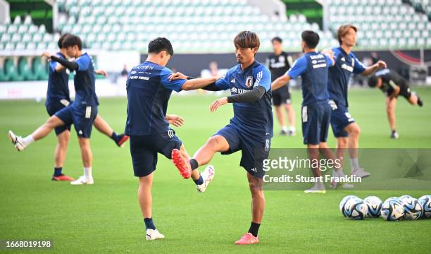 Players of Japan warm up during a training session at Volkswagen Arena on September 08, 2023 in Wolfsburg, Germany.
