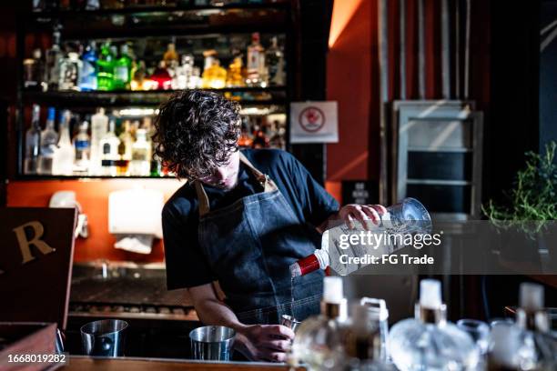 bartender preparing drink on a pub - vodka stock pictures, royalty-free photos & images